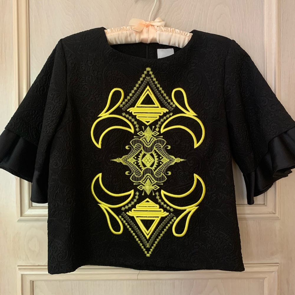 Embroidered brocade top with fluted sleeves